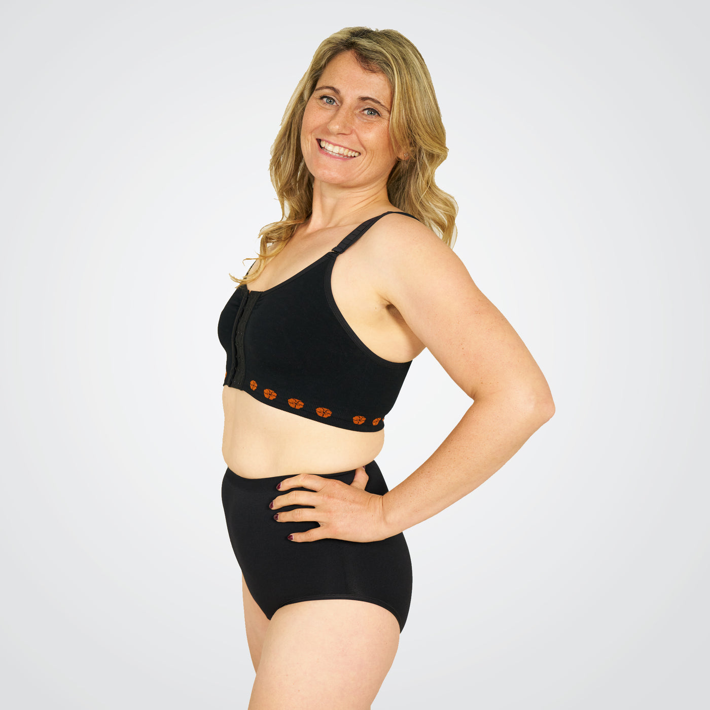 period pants by theya Healthcare modeled by a smiling lady on white background